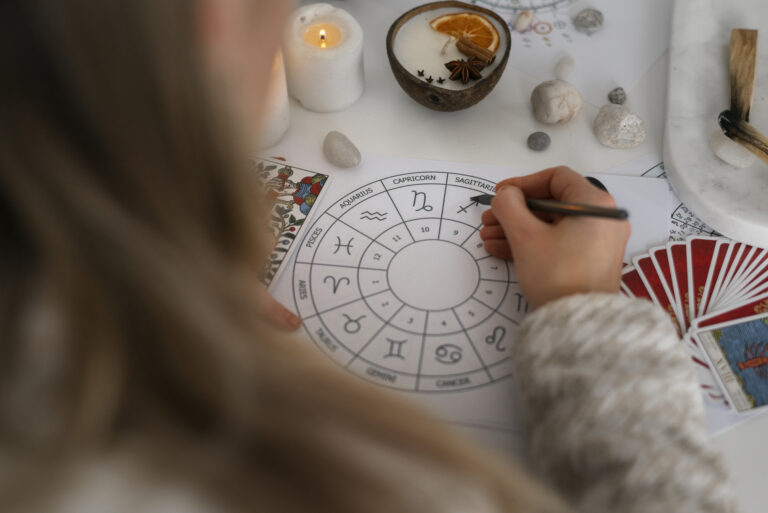 high-angle-woman-reading-tarot-home